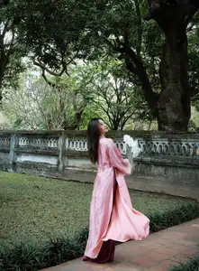 Phan Van Duc's Wife Stuns in Elegant Traditional Ao Dai Amidst Ancient Charm-7