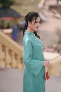 Captivating Charm: Vietnamese Girl's Elegance in a Stunning Mint Green Ao Dai-8