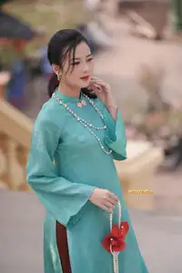 Captivating Charm: Vietnamese Girl's Elegance in a Stunning Mint Green Ao Dai-11