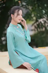 Captivating Charm: Vietnamese Girl's Elegance in a Stunning Mint Green Ao Dai-5