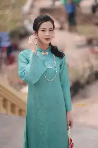 Captivating Charm: Vietnamese Girl's Elegance in a Stunning Mint Green Ao Dai-13