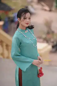 Captivating Charm: Vietnamese Girl's Elegance in a Stunning Mint Green Ao Dai-7