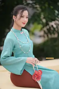 Captivating Charm: Vietnamese Girl's Elegance in a Stunning Mint Green Ao Dai-12