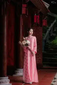 Pink Ao Dai Charm: Discover the Ethereal Beauty of Vietnamese Women in Ancient Heritage Settings.-11
