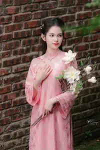 Pink Ao Dai Charm: Discover the Ethereal Beauty of Vietnamese Women in Ancient Heritage Settings.-8
