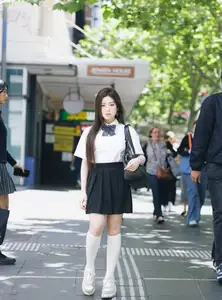 Charming Schoolgirl Embraces Street Style with Classic Uniform.-1