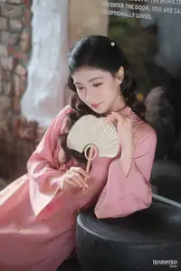 Serene Beauty of a Lady in Pink Traditional Dress with Spring Blossoms-1