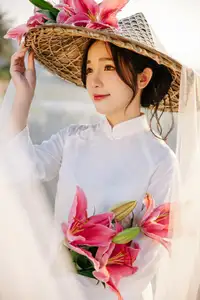 Discover the captivating grace of a Vietnamese woman in a flowing white Ao Dai and traditional conical hat-3