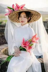 Discover the captivating grace of a Vietnamese woman in a flowing white Ao Dai and traditional conical hat-10