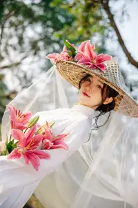 Discover the captivating grace of a Vietnamese woman in a flowing white Ao Dai and traditional conical hat-13