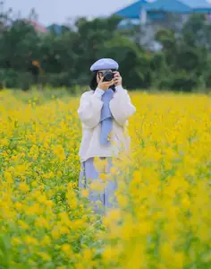 Immerse in Golden Rapeseed Fields: Girl's Artistic Photography Amidst Peaceful Charm, Attracting Year-End Visitors.-11