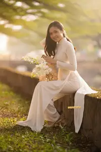 Serene Vietnamese Beauty in White Ao Dai Bathed in Golden Sunset Light-2