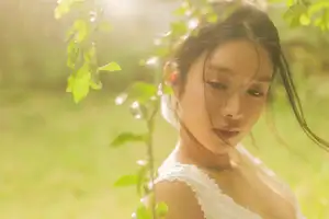 Dreamy Reflection: Girl in white dress finds gentle elegance in a garden mirror.-2