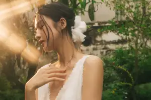 Dreamy Reflection: Girl in white dress finds gentle elegance in a garden mirror.-3
