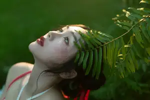 Elegant Woman in White Dress Amidst Lush Green Nature-8