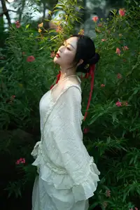 Elegant Woman in White Dress Amidst Lush Green Nature-9