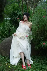 Elegant Woman in White Dress Amidst Lush Green Nature-13