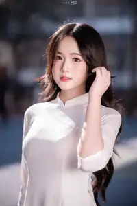 Discover the Grace of White Ao Dai: Vietnamese Girl's Delicate Beauty Shines-1