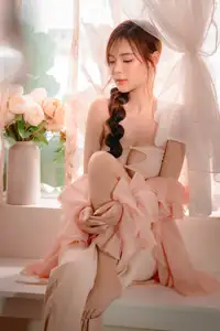 Ethereal Beauty: A Young Woman's Delicate Charm in a Flowing Pink Dress-12