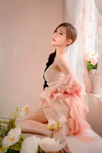Ethereal Beauty: A Young Woman's Delicate Charm in a Flowing Pink Dress-21