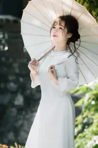 Graceful Vietnamese Girl in Traditional Attire by Ancient Architecture | Discover Asian Beauty and Cultural Charm-4