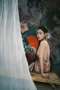 Discover Vietnamese Grace: An Elegant Girl in Ao Yem with a Red Fan.-5