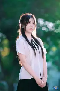 Radiant Youth: Vietnamese Girl's Bright Smile with Pinwheel in Golden Sunlight-1