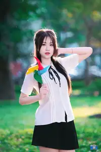 Radiant Youth: Vietnamese Girl's Bright Smile with Pinwheel in Golden Sunlight-6