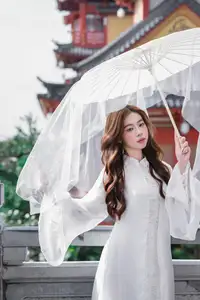 Explore Ethereal Asian Beauty: A Graceful Girl in White Ao Dai Amidst Ancient Oriental Charm-5