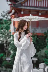 Explore Ethereal Asian Beauty: A Graceful Girl in White Ao Dai Amidst Ancient Oriental Charm-0