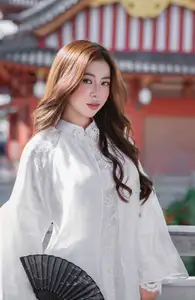 Explore Ethereal Asian Beauty: A Graceful Girl in White Ao Dai Amidst Ancient Oriental Charm-3