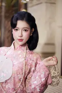 Graceful Pink Ao Dai Beauty: Elegant Vietnamese Woman with Alluring Pearl Jewelry-0