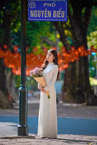 XVG No.55: Vietnamese Ao Dai Charm A Radiant Smile Embracing Youth and Tradition Under Golden Sun-9