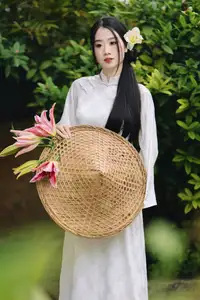 Discover the Grace of a Vietnamese Woman in White Ao Dai with Elegant Lilies-6