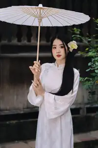 Discover the Grace of a Vietnamese Woman in White Ao Dai with Elegant Lilies-4