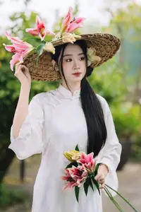 Discover the Grace of a Vietnamese Woman in White Ao Dai with Elegant Lilies-5