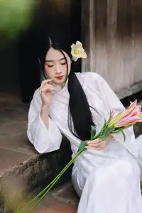 Discover the Grace of a Vietnamese Woman in White Ao Dai with Elegant Lilies-0