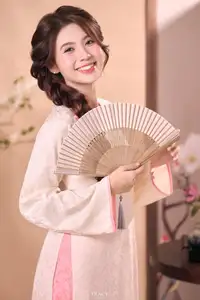 Radiant Smile of a Vietnamese Girl in Modern Ao Dai and Elegant Fan-0