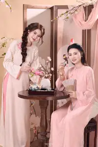 Radiant Smile of a Vietnamese Girl in Modern Ao Dai and Elegant Fan-3