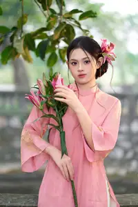 Elegant Pink Ao Dai Amidst Ancient Architecture Capturing Timeless Traditional Beauty-2
