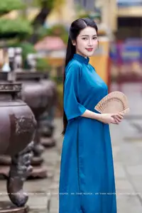 Vietnamese Ao Dai Charm: Elegant Lady in Teal Blue Dress, A Captivating Vision of Grace-3