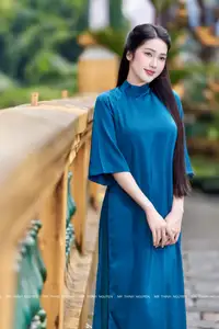 Vietnamese Ao Dai Charm: Elegant Lady in Teal Blue Dress, A Captivating Vision of Grace-1