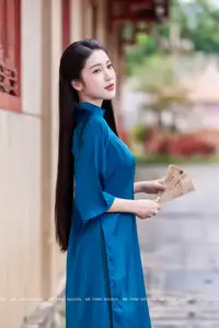 Vietnamese Ao Dai Charm: Elegant Lady in Teal Blue Dress, A Captivating Vision of Grace-2