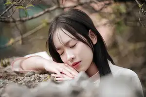 Timeless Elegance: Vietnamese Woman in Traditional Ao Dai Amidst Serene Backdrop-3