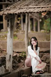 Timeless Elegance: Vietnamese Woman in Traditional Ao Dai Amidst Serene Backdrop-7