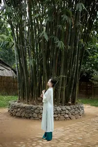 Vietnamese Grace: Elegant Portrait of a Young Woman in Lush Nature-19