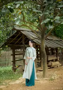Vietnamese Grace: Elegant Portrait of a Young Woman in Lush Nature-15