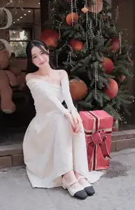 Elegant Girl in Off-Shoulder White Dress Welcoming Christmas, Showcasing Gentle Beauty and Holiday Season Style. 1000027390-8