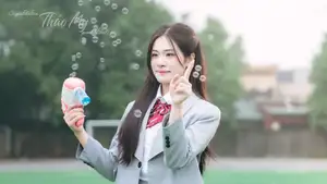 Cute Schoolgirl Frames a Moment on Green Grass-5