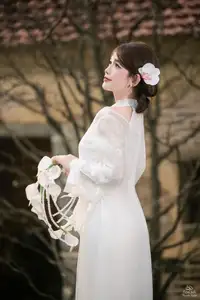 Elegant Asian Beauty: A Gentle Girl Adorned with a Pure White Orchid-13